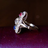 Anello antico in oro bianco 18K con diamanti, rubino e zaffiro, anni '20/'30 - Antichità Galliera
