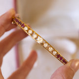 Bracelet rigide en or 14 carats avec diamants (1.40 ct environ) et rubis (1.30 ct environ), années 50