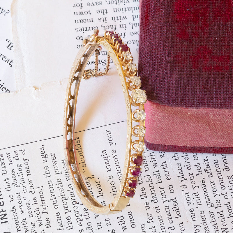 14K gold rigid bracelet with diamonds (1.40ctw approx.) And rubies (1.30ctw approx.), 1950s
