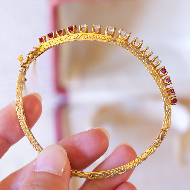 14K gold rigid bracelet with diamonds (1.40ctw approx.) And rubies (1.30ctw approx.), 1950s