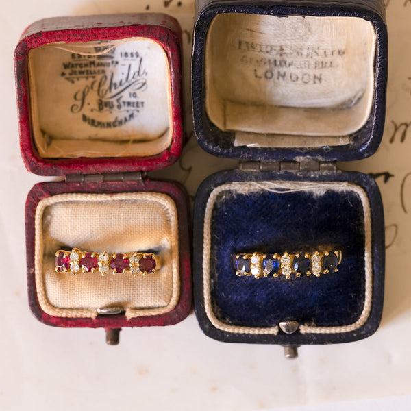 Pair of 18K yellow gold rings with rubies, sapphires and diamonds (0.24ctw approx.), 1960s / 70s