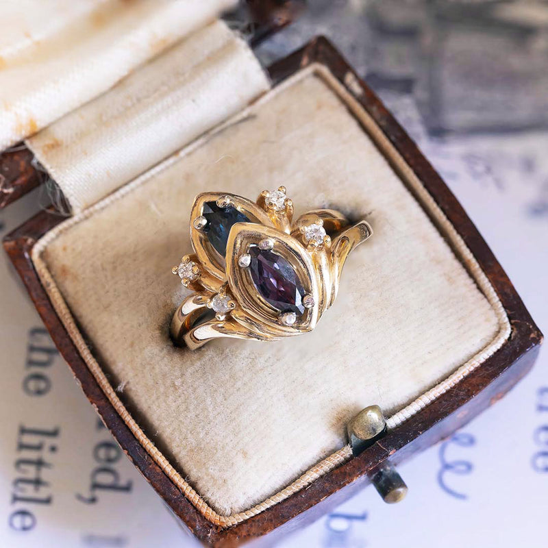 Vintage 14K gold navette ring with diamonds and purple sapphire