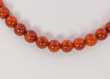 Vintage red coral ball necklace with 14k gold clasp
