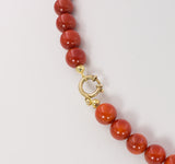 Vintage red coral ball necklace with 14k gold clasp