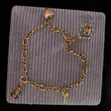 Antikes Armband aus 18 Karat Gold mit Charms, Anfang des 900. Jahrhunderts