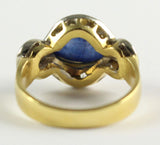 Ring aus 18 Karat Gold mit zentralem Cabochonsaphir und Diamanten im Brillantschliff, 50er Jahre - Antichità Galliera