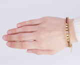 Pulsera vintage de oro de 14 quilates con diamantes (1.40 quilates aprox.) y rubíes (1.30 quilates aprox.), años 50