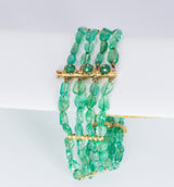 Bracelet in 18k gold and emeralds, 60s