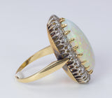 Vintage Ring aus 18 Karat Gold mit australischem Opal und Diamanten im Brillantschliff (0.80 ct), 50er Jahre