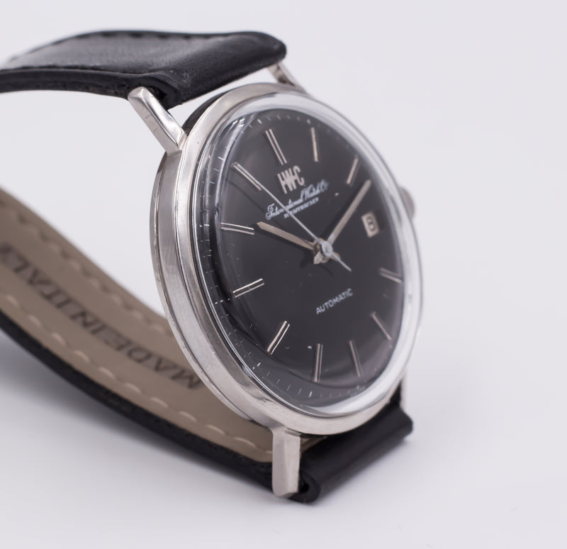 Orologio da polso vintage IWC International Watch Company in acciaio, automatico con data. 1960 circa