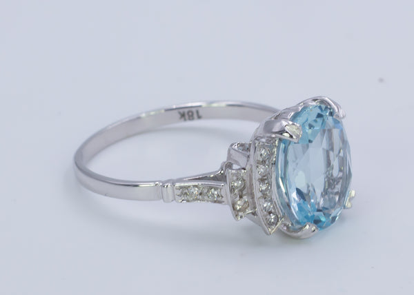 Gold ring with diamonds and aquamarine