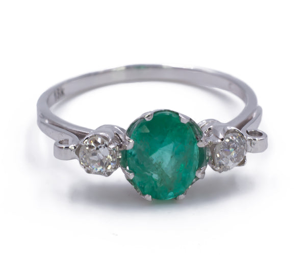 Vintage white gold ring with central emerald and diamonds, 1950s