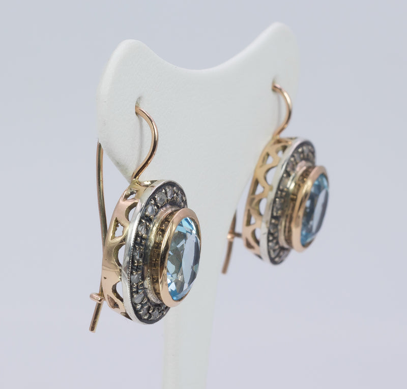 Orecchini vintage in oro e argento con topazi azzurri e rosette, stile primi del ‘900