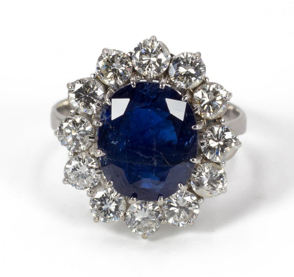 Vintage white gold ring with central sapphire and diamonds, 1950s