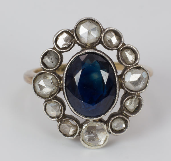 Antique gold and silver ring with central sapphire and diamonds, early 1900s