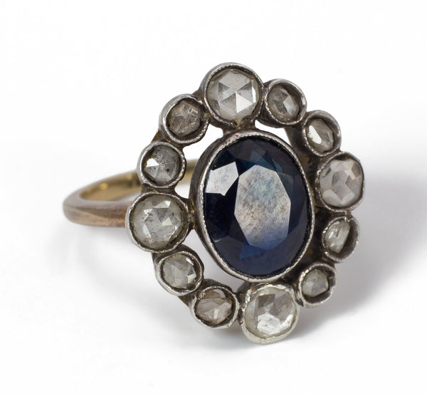 Antique gold and silver ring with central sapphire and diamonds, early 1900s