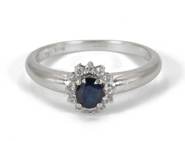 Vintage white gold ring with central sapphire and brilliants, 1960s