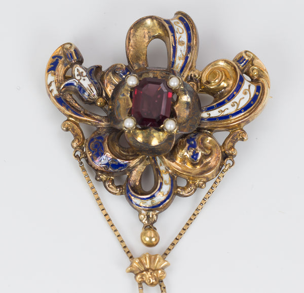 Antique gold brooch with enamels and garnet, second half of the 19th century.