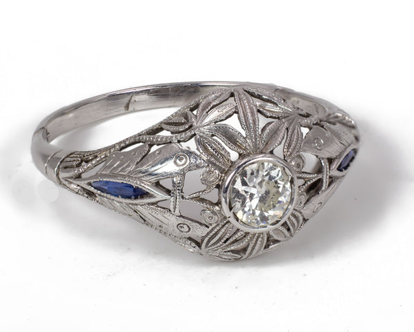 Antique 18k white gold ring with central diamond (approx.0.25 ct) and sapphires, 1930s