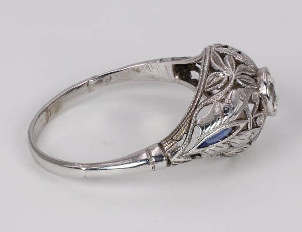 Antique 18k white gold ring with central diamond (approx.0.25 ct) and sapphires, 1930s