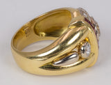 Vintage Ring aus 18 Karat Gold mit zentralem (1.28 Karat) und seitlichem (0,15 Karat) Diamant und Pavé aus Diamanten und Rubinen, 70er Jahre