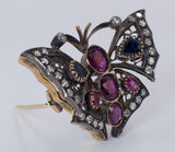 Vintage Schmetterlingsbrosche aus 18 Karat Gold und Silber mit Diamanten, Saphiren und Rubinen. 50er Jahre