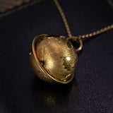 Vintage pendant in the shape of a globe in 18K gold, 70s - Antichità Galliera
