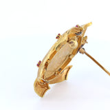 Vintage 18k gold brooch with 24k gold British pound and rubies. late 60s