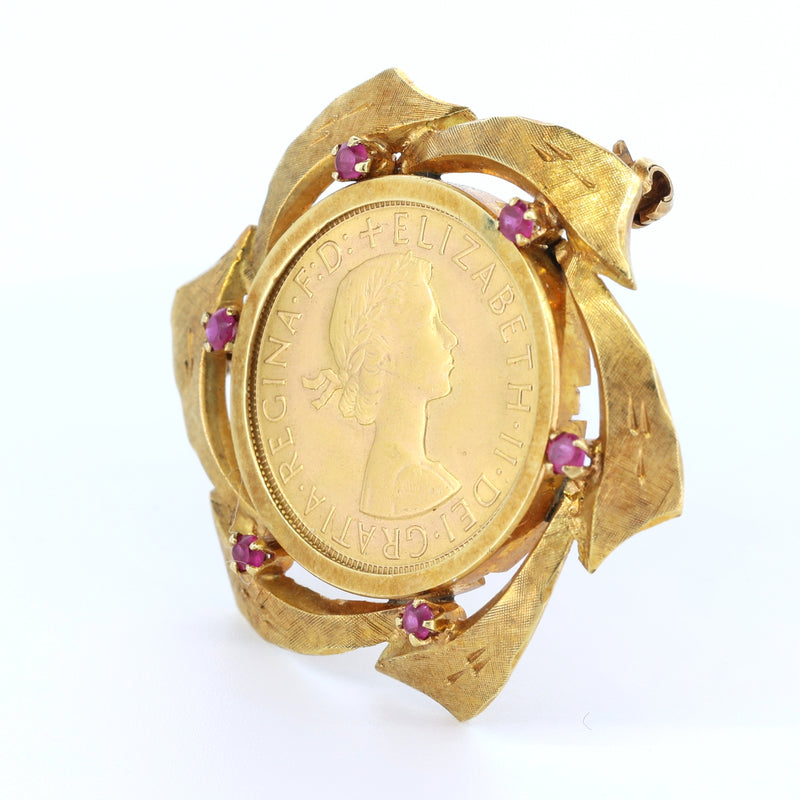 Vintage 18k gold brooch with 24k gold British pound and rubies. late 60s
