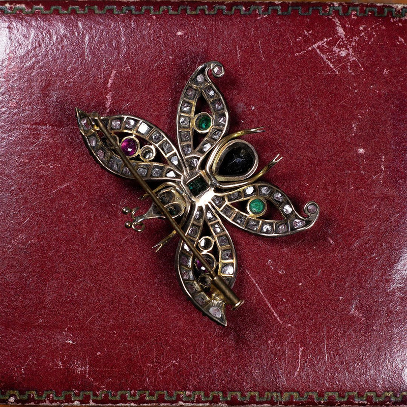 Spilla art Nouveau a farfalla in oro 18K e argento con rosette, rubini, smeraldi e zaffiro - Antichità Galliera