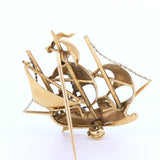 Vintage sailing ship-shaped brooch in 18K gold with rubies, 60s