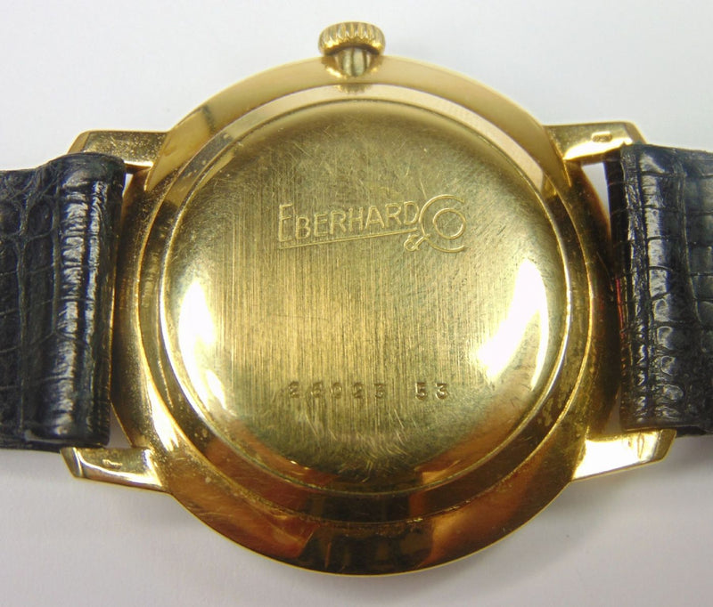 Orologio da polso in oro Eberhard automatico con datario. Anno 1975 . Con scatola e garanzia - Antichità Galliera