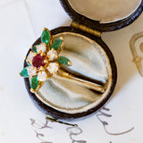 Anello vintage in oro 18K con diamanti (0.50ctw ca.), rubino (0.30ct ca.) e smeraldi (0.90ctw ca.), anni ‘70/‘80