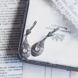 Art Deco earrings in platinum and 18K white gold with rosette cut diamonds, 30s