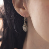 Art Deco earrings in platinum and 18K white gold with rosette cut diamonds, 30s
