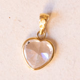 Lot including 18K gold pendant with zircon and pendant in the shape of a card of two of hearts in 18K gold