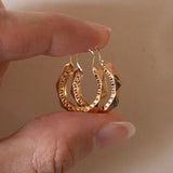 Vintage faceted hoop earrings in 18K gold, 60s
