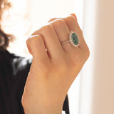 18K white gold daisy ring with emerald (4.47ct) and brilliant cut diamonds (0.76ct)
