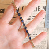 Halbstarres Vintage-Armband aus 14 Karat Gelbgold mit Saphiren (ca. 3.60 ctw) und Diamanten, 60er/70er Jahre