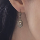 Art Deco earrings in platinum and 18K white gold with rosette cut diamonds, 30s